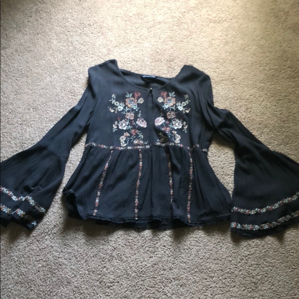 Bell sleeve embroidered top.